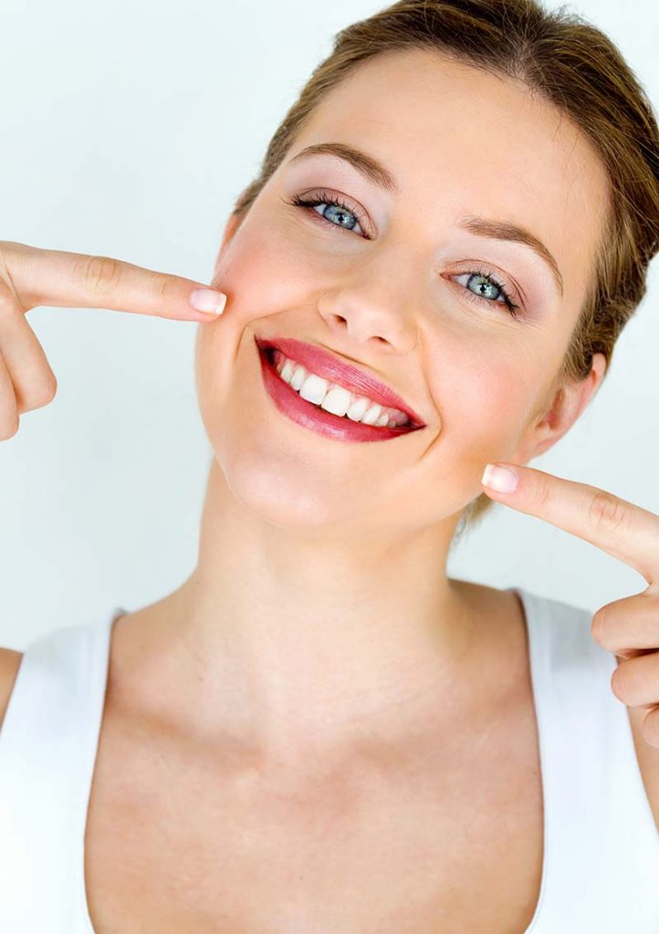 woman in white shirt smiling